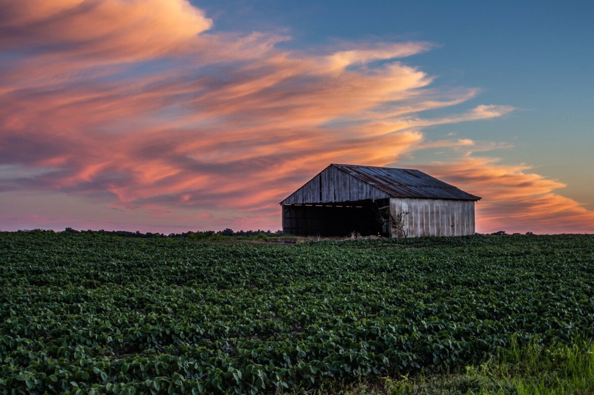 farmland in indiana with barn at sunset