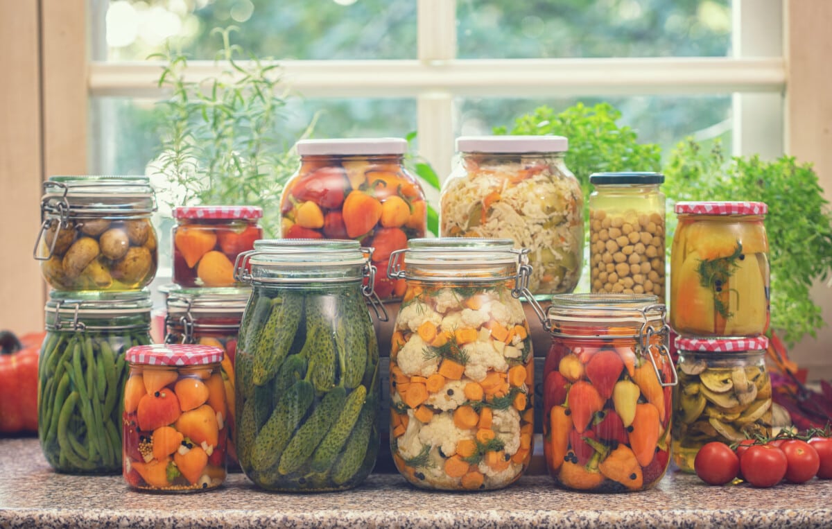 Freshly pickled organic vegetables in jars at home