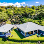 home in holualoa hawaii with lush greenery