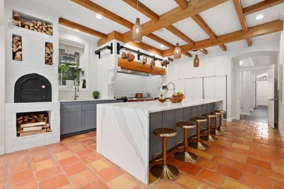 Kitchen with terra cotta tiles and a built-in fireplace