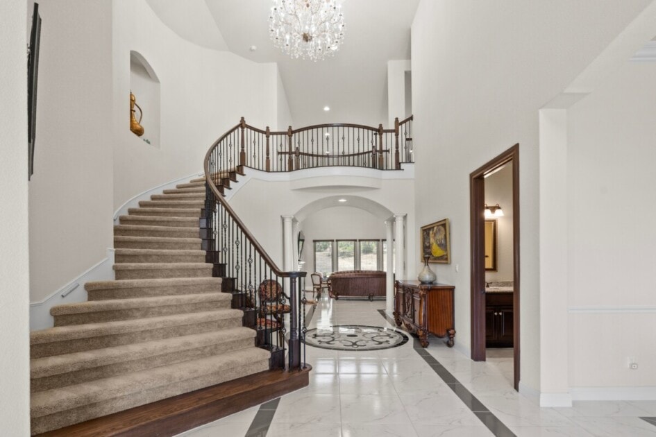 Staircase in entry way of luxury home