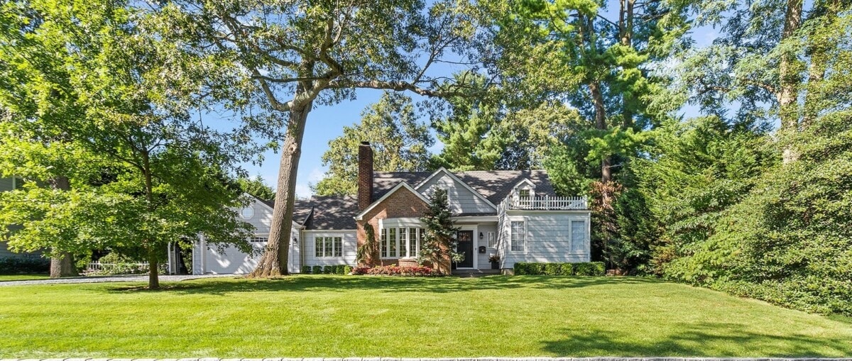 Home in new york with brick exterior and an expansive yard
