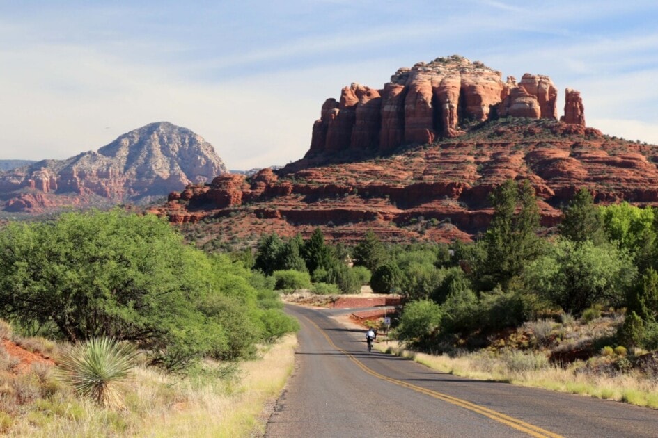 Biker near rock formation in Sedona, AZ