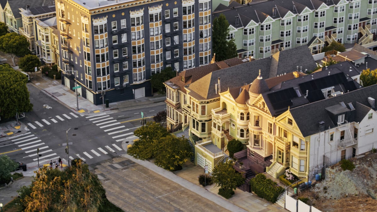 Aerial view of Historical Victorian Houses of Alamo Square during sunset, San Francisco, California, USA.