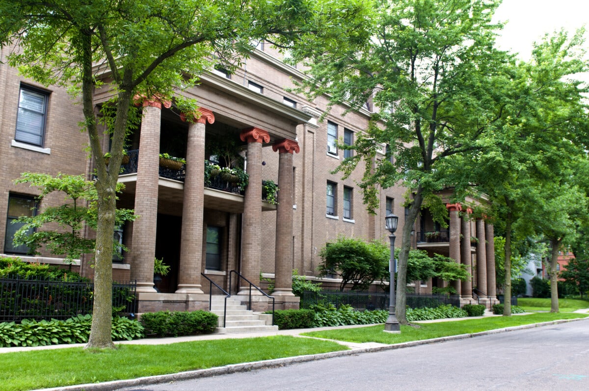 A modern brick condominium or apartment building built in a residential neighborhood in St. Paul, Minnesota,
