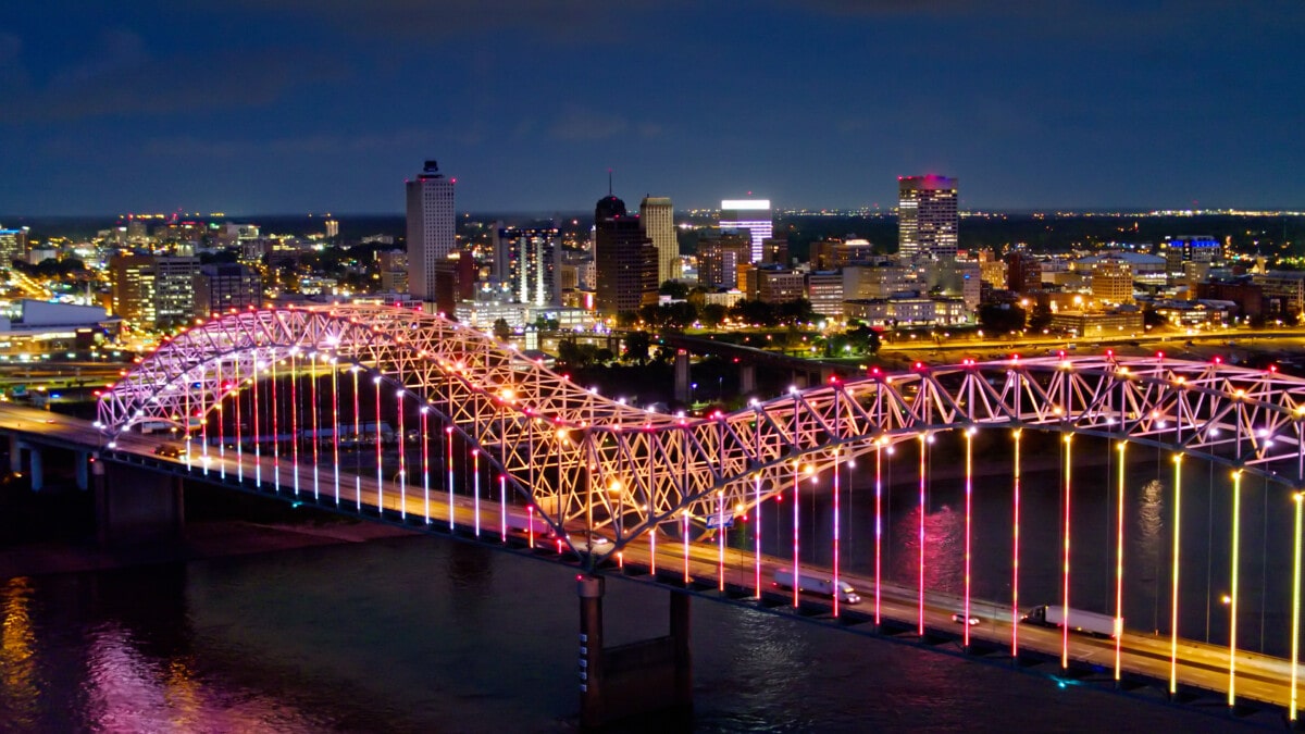 Aerial shot of the spectacular light show on the Hernando de Soto Bridge, which carries Interstate 40 across the Mississippi between Tennessee and Arkansas, with downtown Memphis in the background.