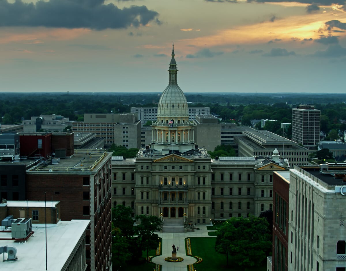 Drone shot of the Michigan State Capitol Building in Lansing on a summer evening.