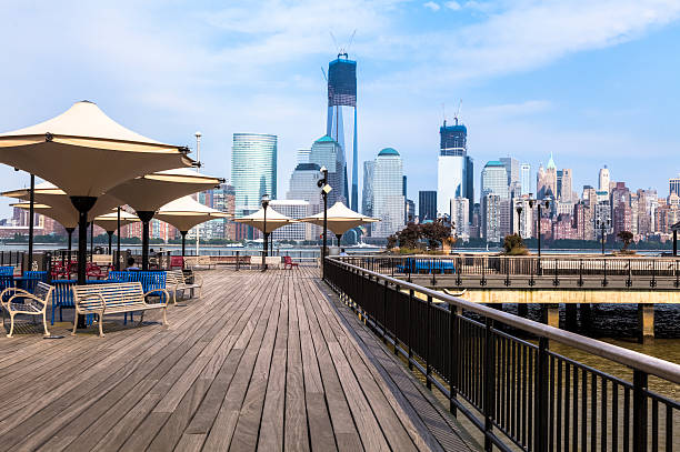 Lower Manhattan Skyline and the Hudson River Waterfront Walkway in Jersey City, New Jersey.