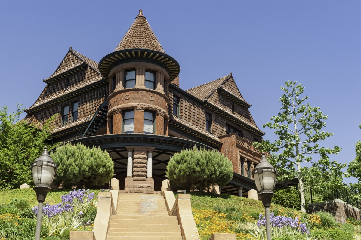"Clear blue desert skies over the gothic turrets and colorful gardens of the historic Alfred McCune mansion building on Capitol Hill in dowtown Salt Lake City, Utah. ProPhoto RGB profile for maximum color fidelity and gamut."
