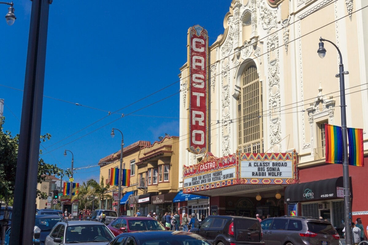 castro theater busy street with people and cars