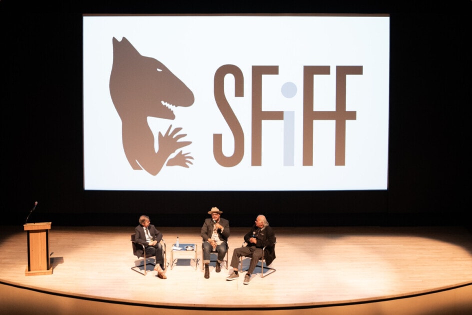 Three people sit on a stage at SFiFF, discussing film. 