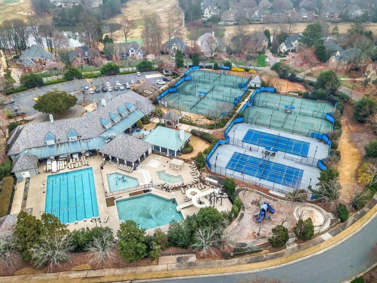 aerial-view-of-pool-and-tennis-court-amenities-in-residential-neighborhood-1.jpg