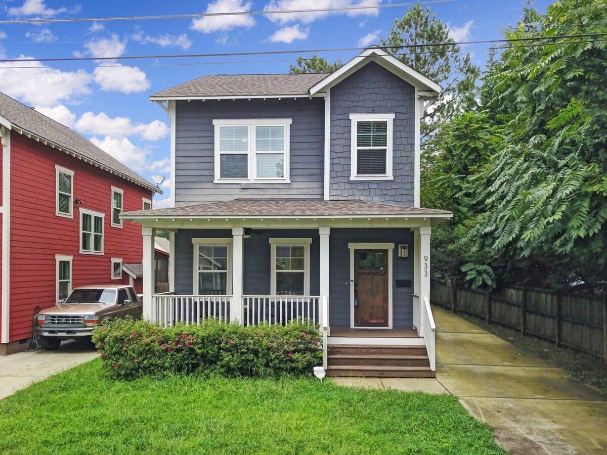 blue-two-story-single-family-home-with-front-porch-in-noda-2.jpg