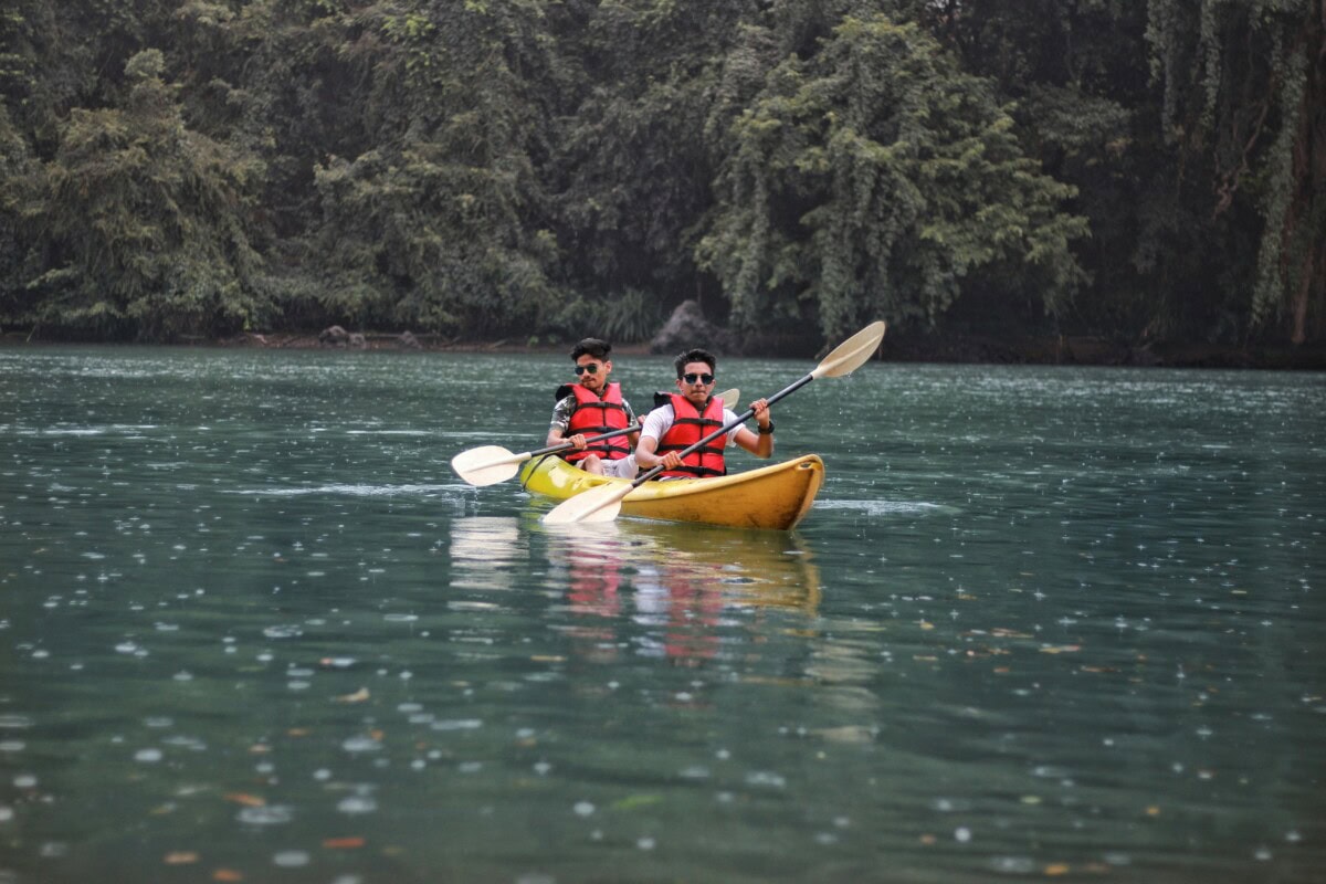 friends kayaking on a lake