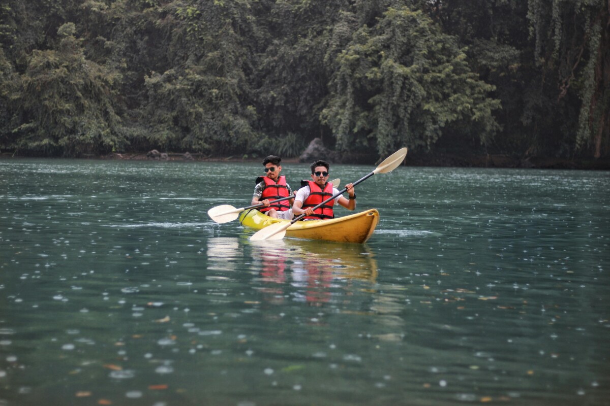 friends kayaking on a lake
