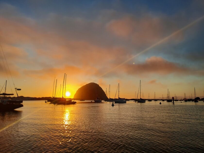Sunset astatine  Morro Bay, a halt  connected  the San Luis Obispo bucket database  for respective  tours 