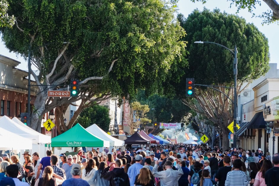 Busy thoroughfare  with radical   and tents for the San Luis Obispo Downtown Farmer's Market, 1  of the galore  stops connected  the San Luis Obispo bucket list