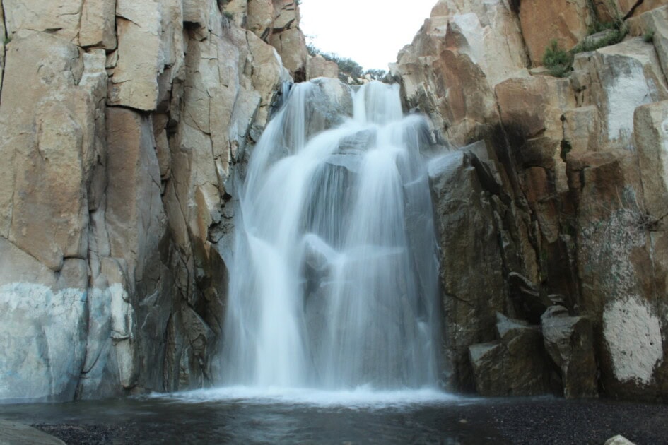 Rocks and white streams of water at Ortega Falls, an item on the ultimate Lake Elsinore bucket list
