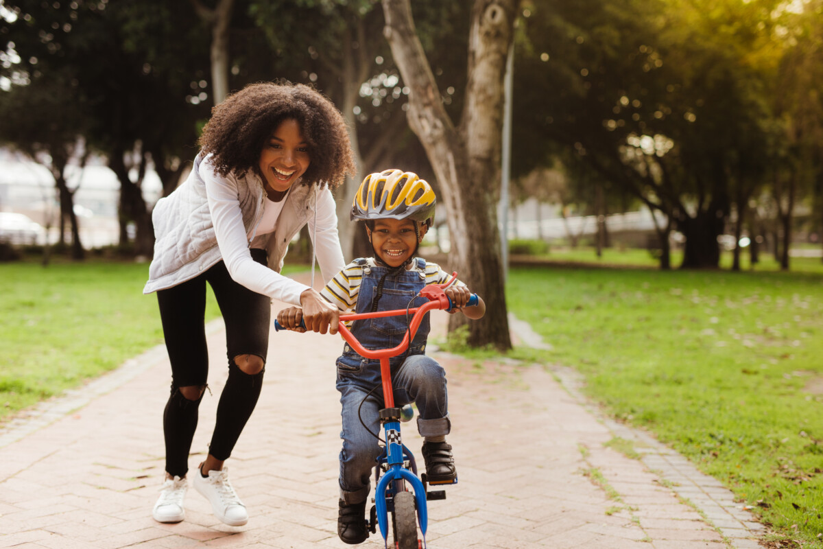 kid learning to ride a bik