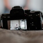 Camera Viewfinder view of man sitting