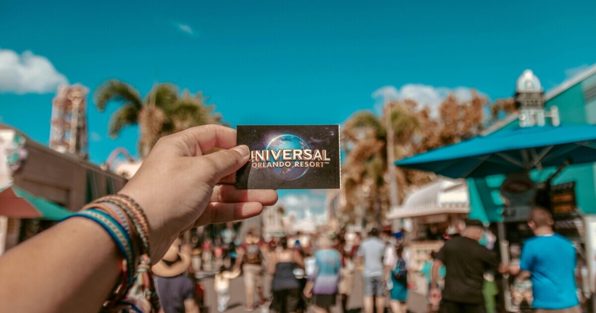Person holding universal studio ticket, one of the many unique things to do in Orlando.