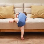 baby climbing couch