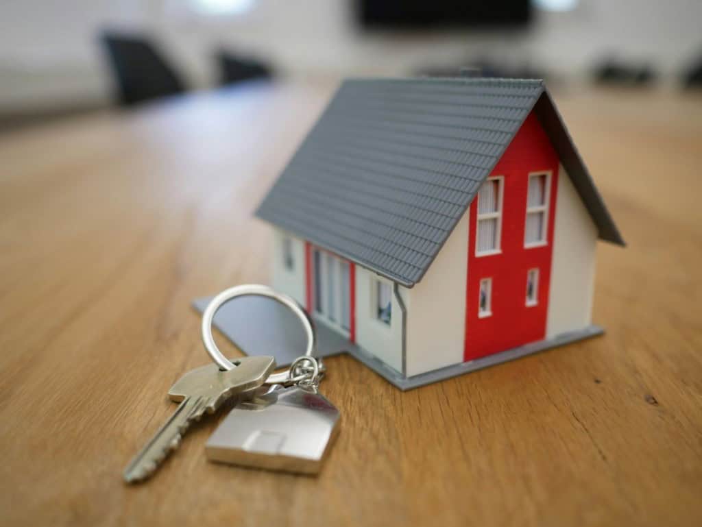 house sitting on a table next to a key