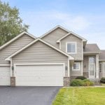 Two story house with front facing garage in Minneapolis, MN.