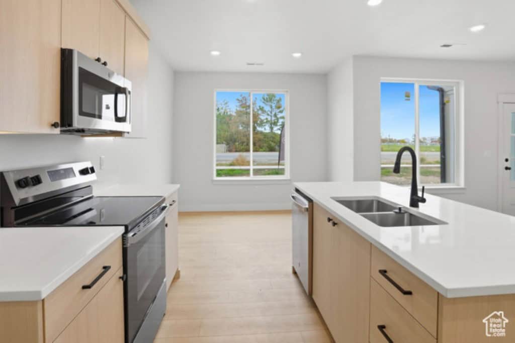 A modern kitchen with natural light at 62 E 1225 S, Tremonton, UT 84337 is a townhome for sale on Redfin.