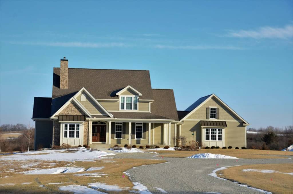 Two-story house with front facing windows sold using a net listing agreement.