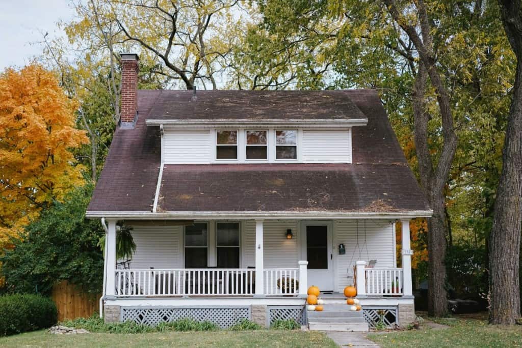 An older home with a roof that is starting to sag, potentially requiring a structural inspection