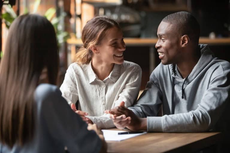 Couple finalizing the deal on their property abroad