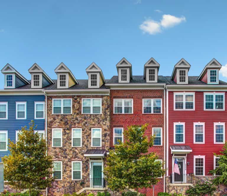 Row of townhomes with a clear blue sky